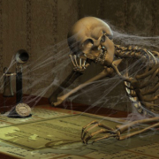 Skeleton sitting at desk looking bored